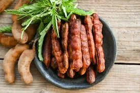 Sweet Tamarind fruit on the plate, fresh pulp ready to eat
