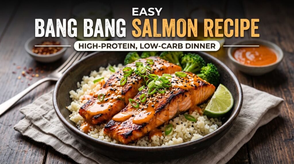 Bang bang salmon with creamy spicy sauce, golden seared fillets, fresh lime, green onions, and roasted broccoli for a low-carb dinner.
